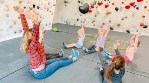 our sprouts on route youthing climbing program teach kids as early as 3 how to move and climb with fun games for kids, engaging physical activies and introduction to climbing basics